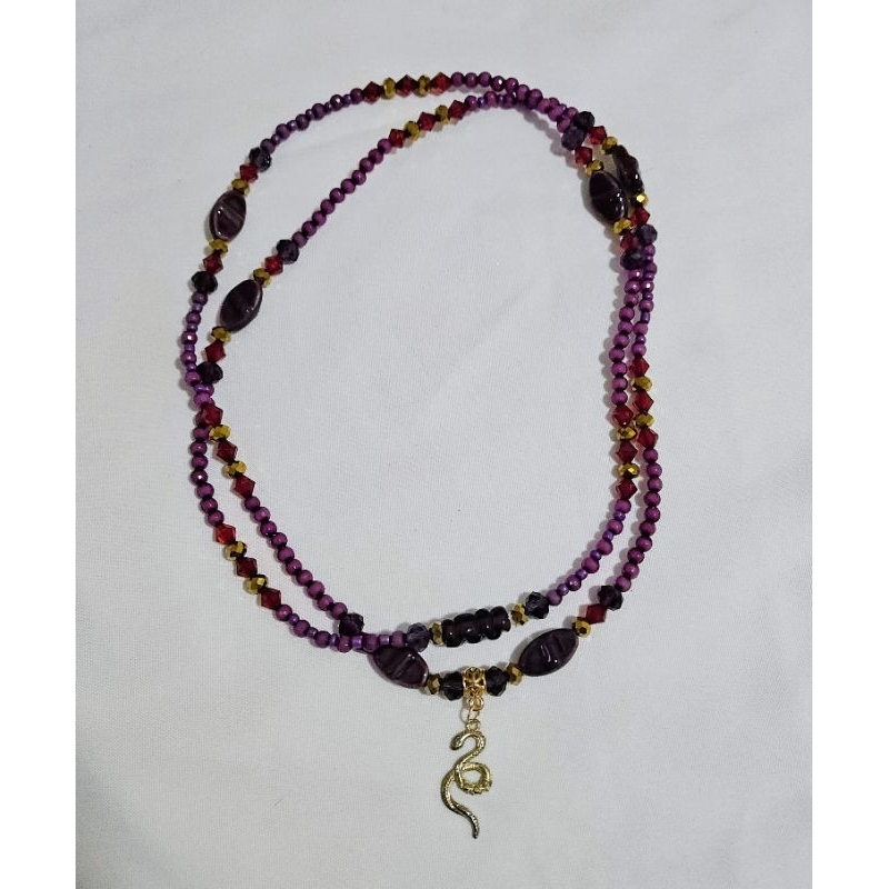 Guia pombagira roxo vermelho dourado e cobra Maria Padilha Mulambo Figueira Farrapo Quiteria Umbanda Candomblé