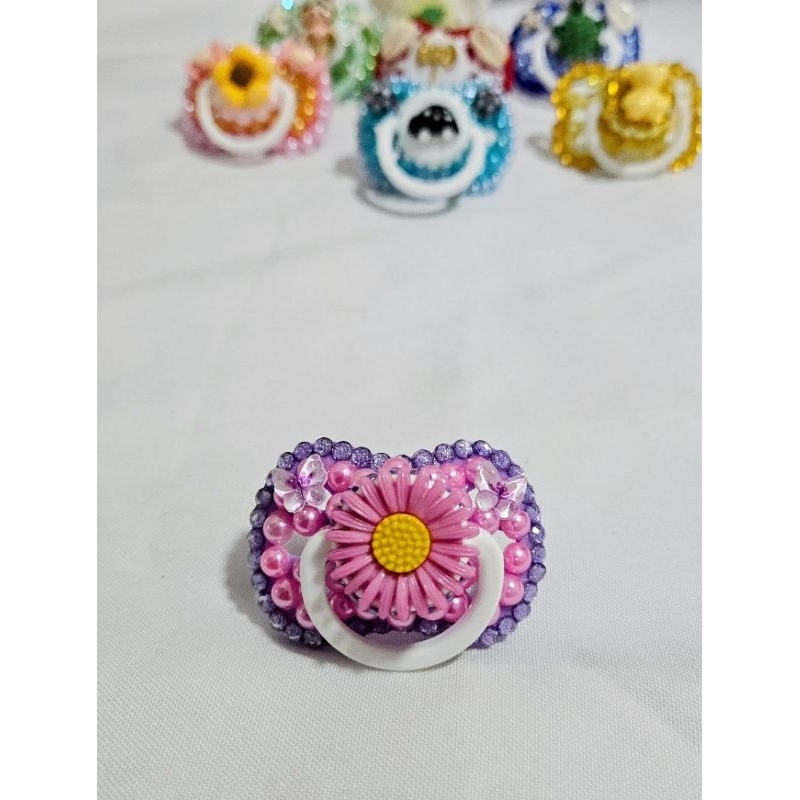 Chupeta erê rosa e lilas margarida mariazinha rosinha aninha iemanja oxum oyá iansa praia jardim Umbanda Candomblé