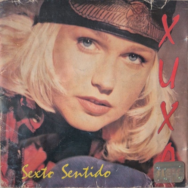 Cd Xuxa Sexto Sentido Capa com muitas marcas de uso, mídia com pequenas fissura na borda.
