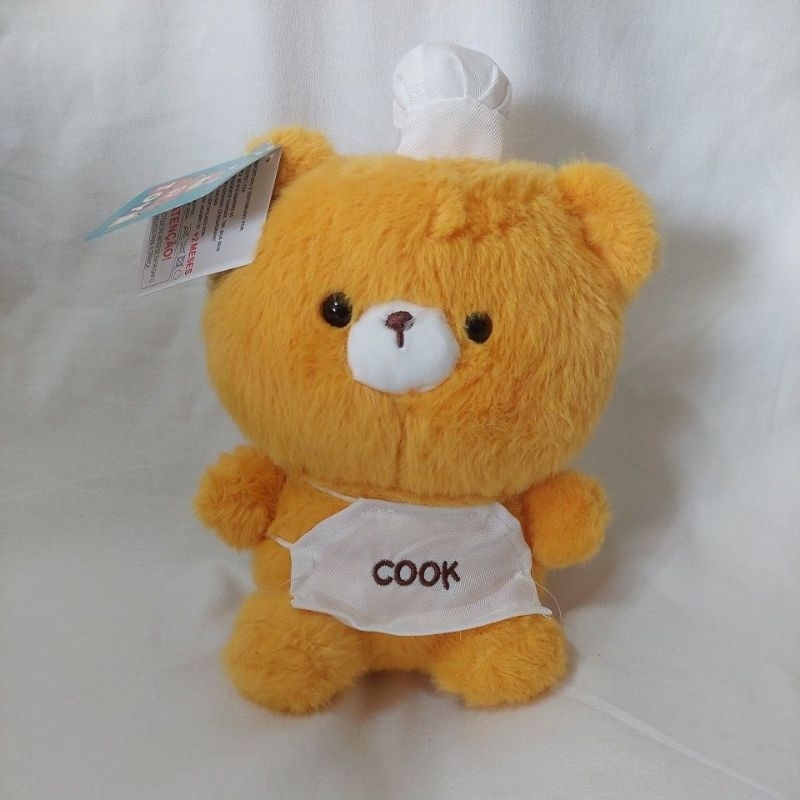 Urso de pelúcia bege, chapéu e avental COOK, 25cm de altura