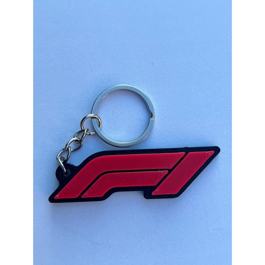 Chaveiro F1 logo presente