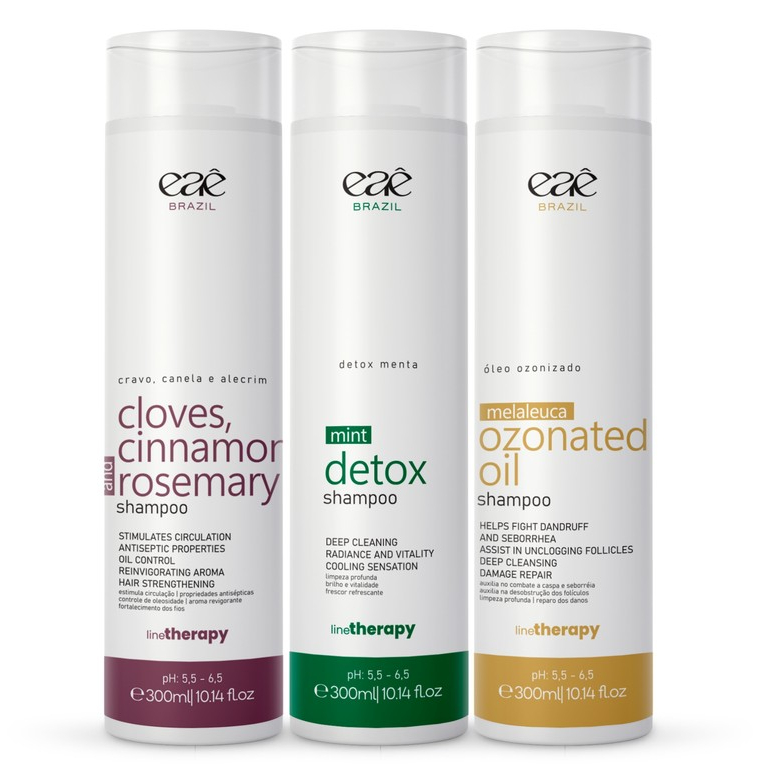 Três frascos de shampoo Eaê Brasil de 300ml cada, sendo um de cravo, canela e alecrim, um detox de menta e um de óleo ozonizado, alinhados lado a lado sobre fundo branco.