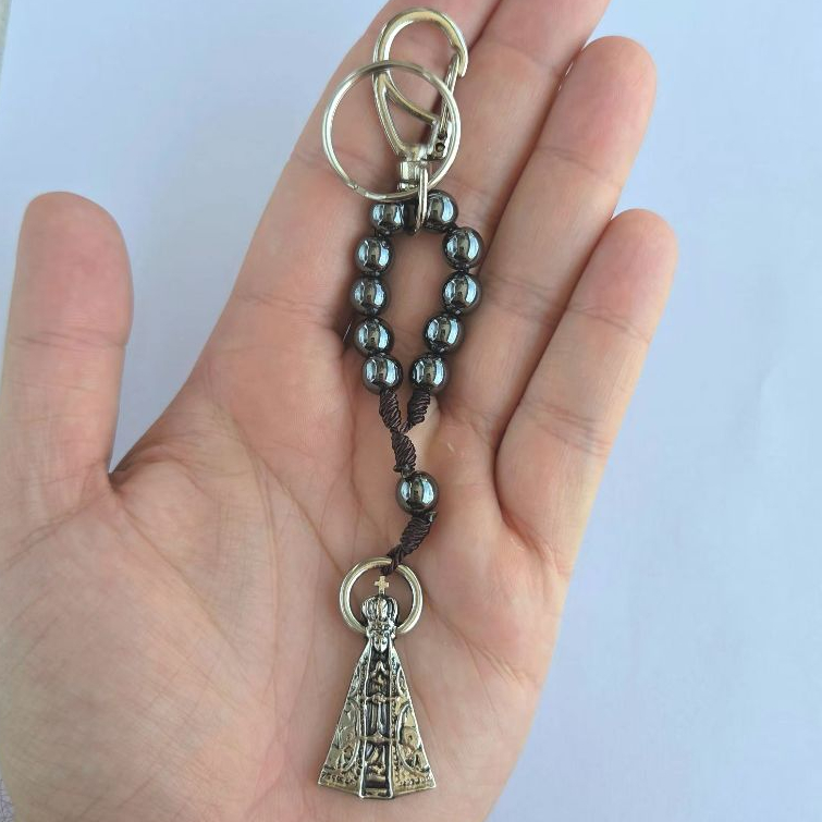 Chaveiro Dezena Hematita com Imagem de Metal do Santo — Proteção e Devoção | Escolha Seu Santo
