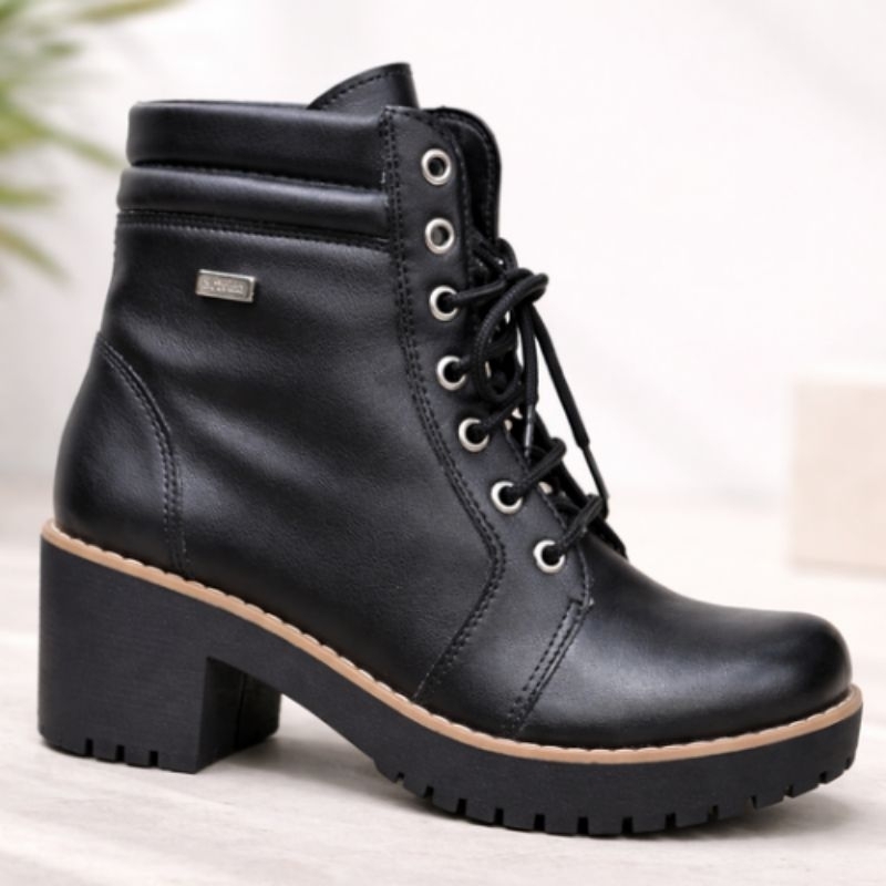 BOTA COTURNO COM SALTO TRATORADO 2006