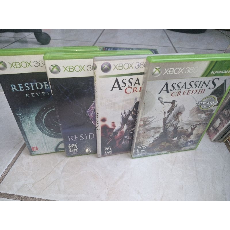 Lote de Jogos Xbox 360 Originais Resident Evil Revelations , Resident Evil 6 e Assassin's Creed 2 e 3