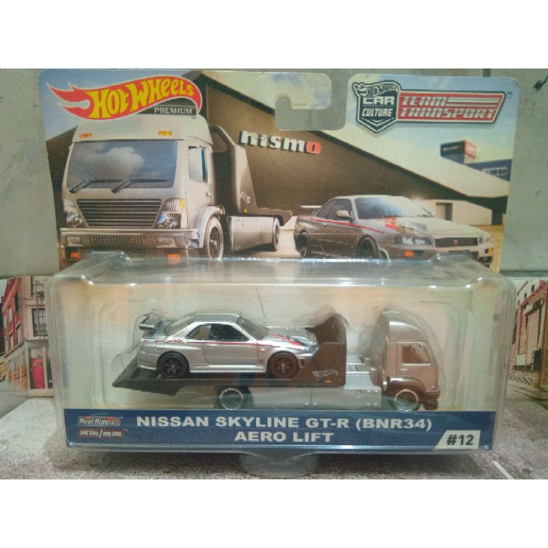 hot wheels team transport Nissan skyline GT-R "bnr34"/aero lift premium (rodas com pneus de borracha)