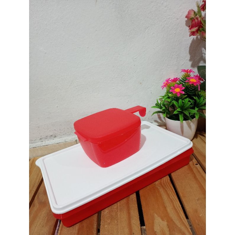 Refri box e conserva metade Tupperware.