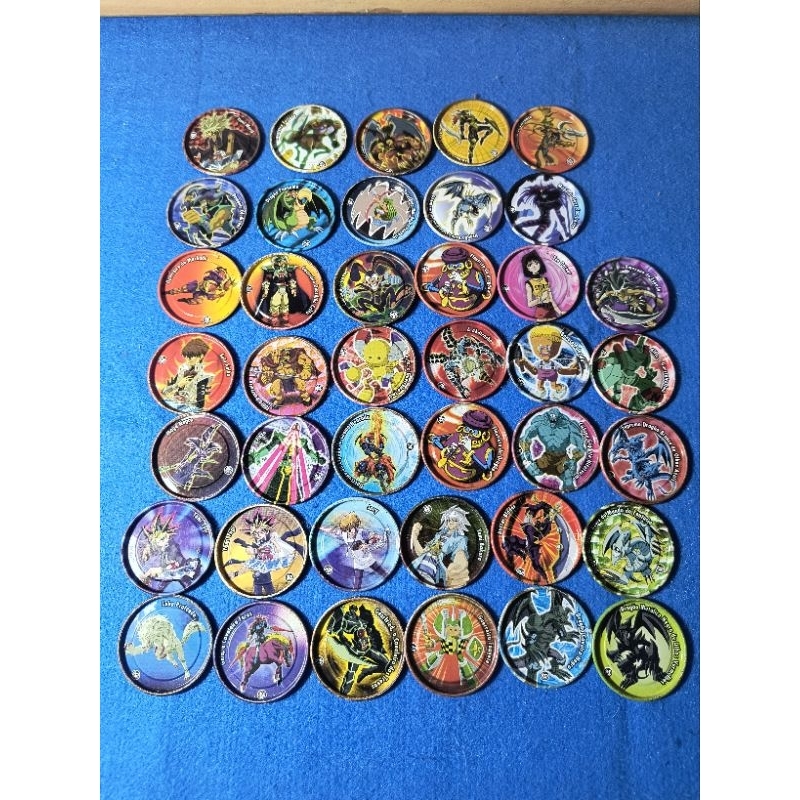 Lote de tazos em metal Yu-Gi-Oh