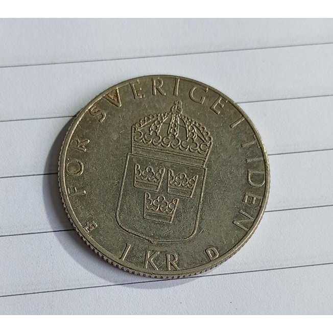 Moeda Suécia 1 Krona 1988 – Carl XVI Gustaf e Silvia – För Sverige i Tiden