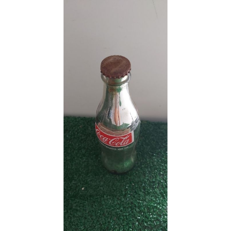Garrafa de vidro antiga de Coca-Cola
