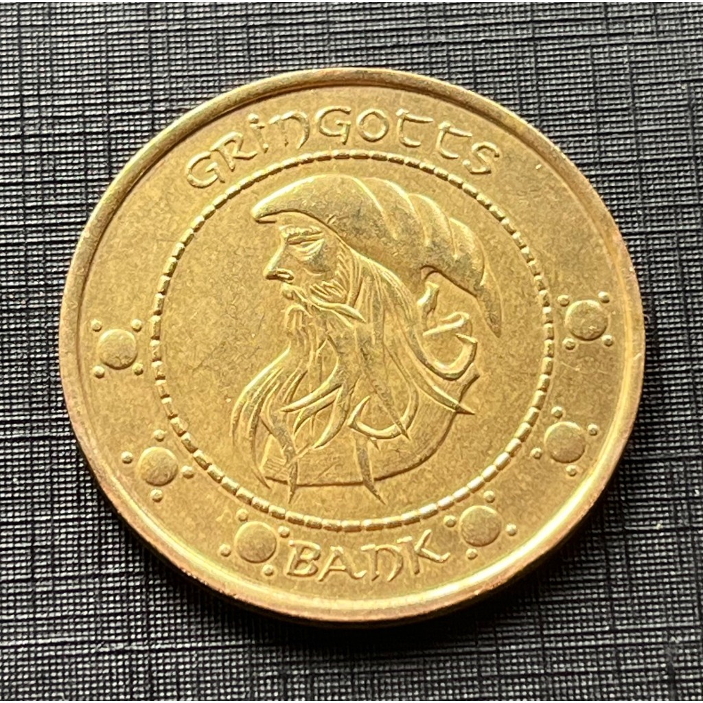 Ficha Unum Galleon do Gringotts Bank 16g e 3.8cm alusiva ao Filme Harry Potter e a Pedra Filosofal. Item de Coleção