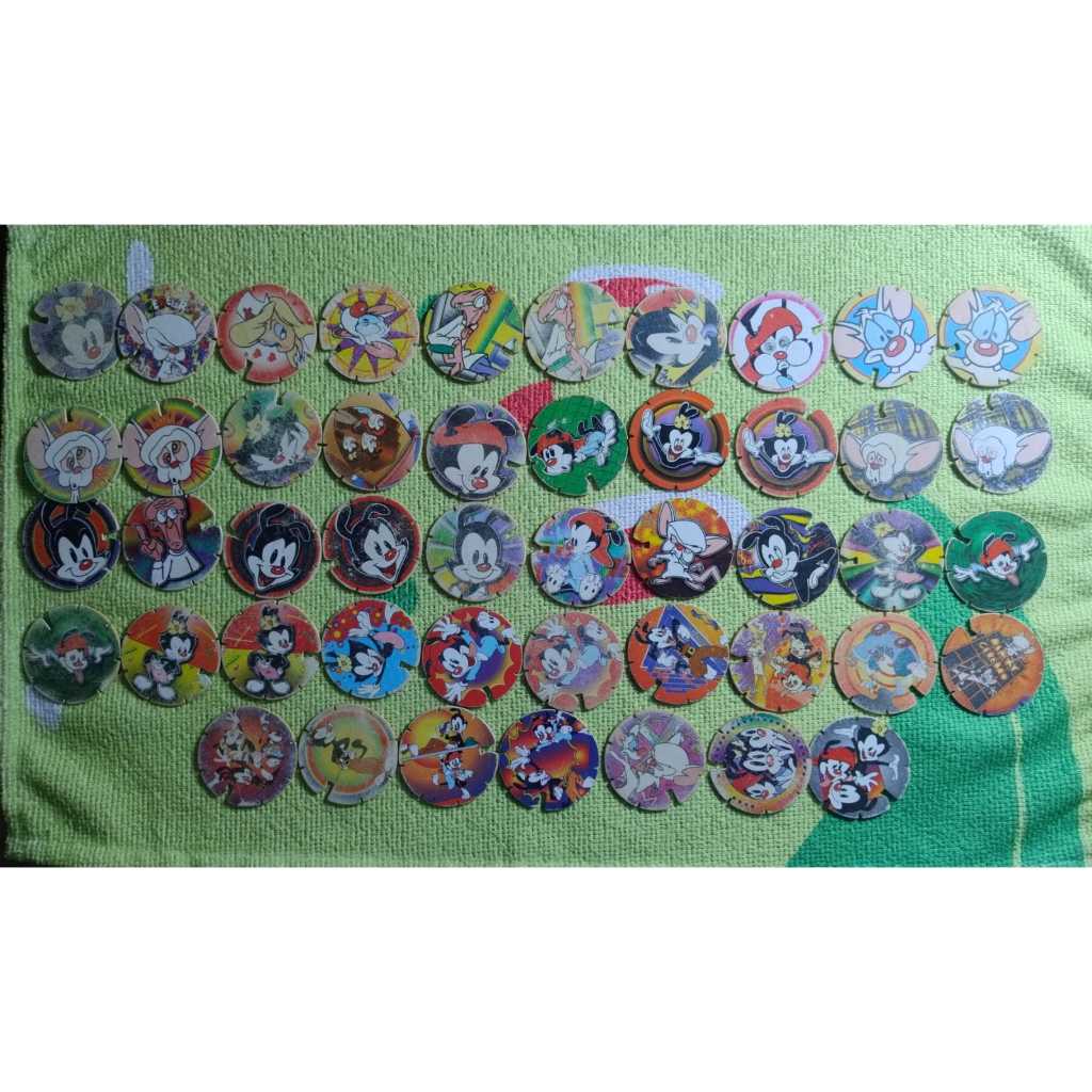 Lote de Tazos Animaniacs Arma e Voa  47 Tazos (38 Diferentes + 9 Repetidos) Elma Chips Originais