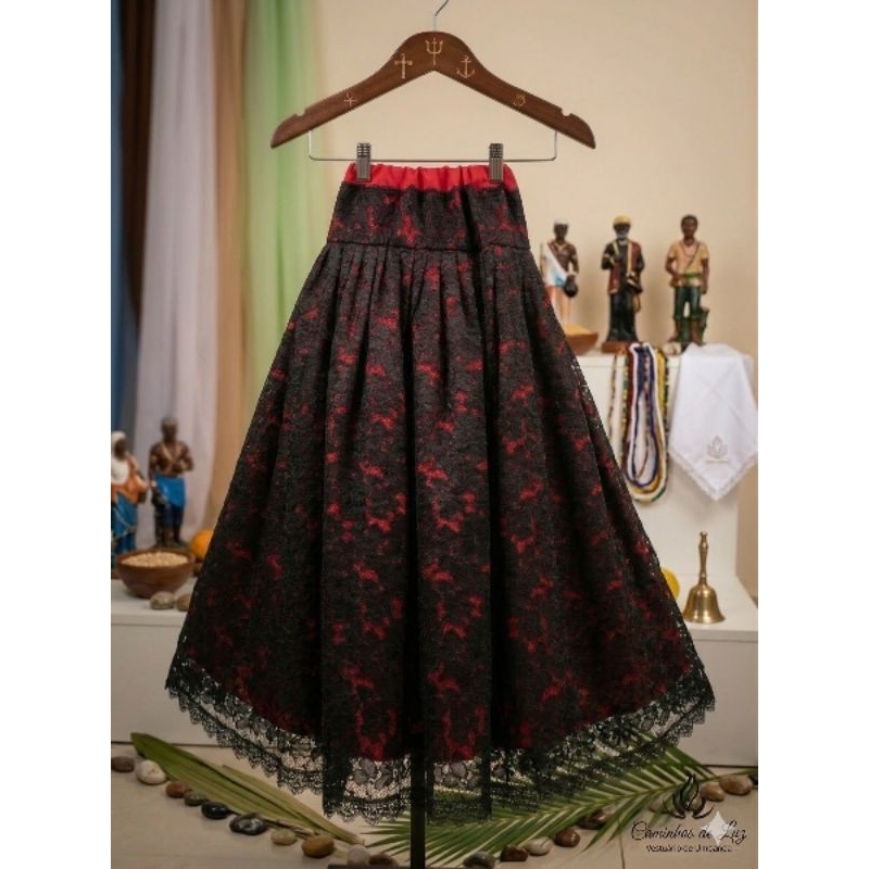 saia de renda preta com forro vermelho,ou toda preta ambas com acabamento em gripir, pode ser outra cor forro umbanda