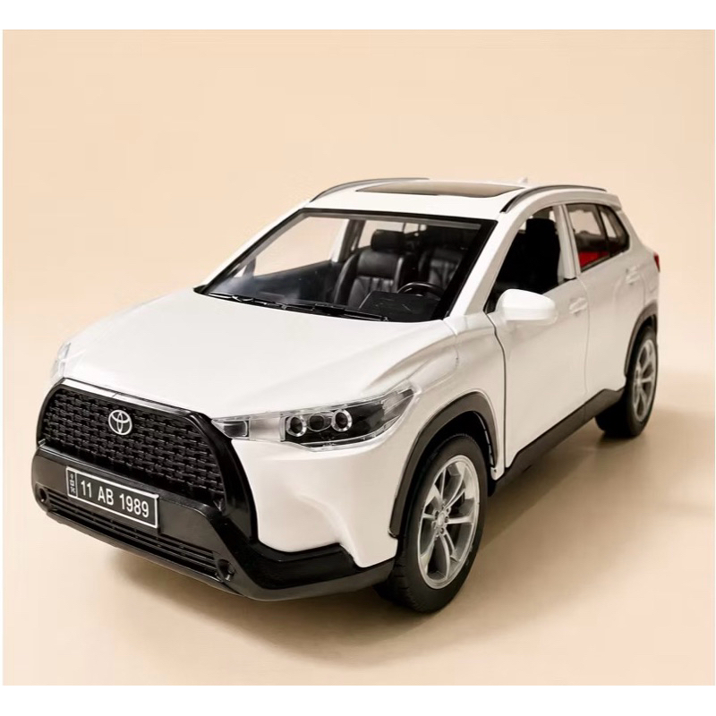 Miniatura Toyota corolla Cross 1/32 som e luz