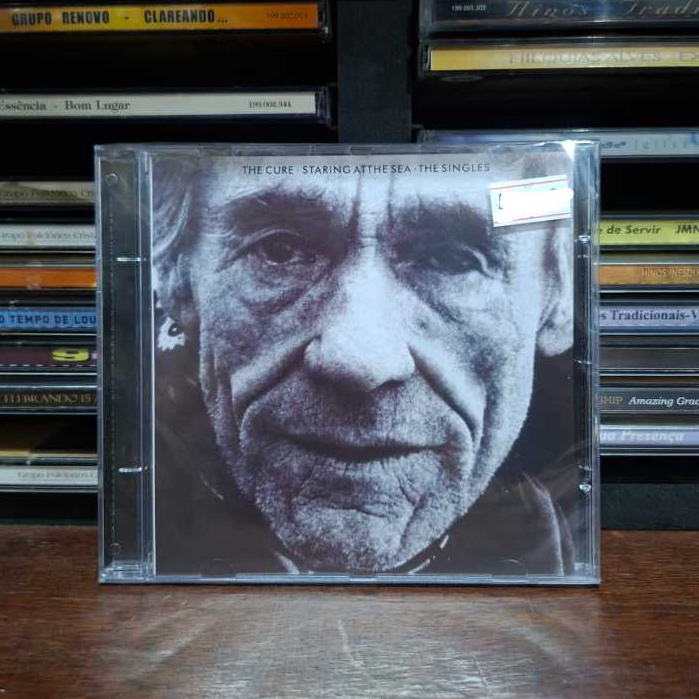 CD THE CURE - STARING ATTHE SEA - THE SINGLES (LACRADO)