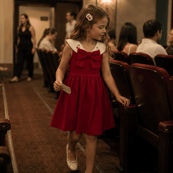 Vestido malha poá com laço frontal menina