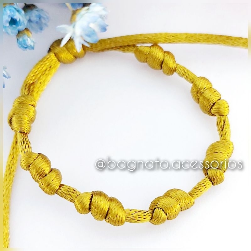 Pulseira de proteção 7 nós dourada