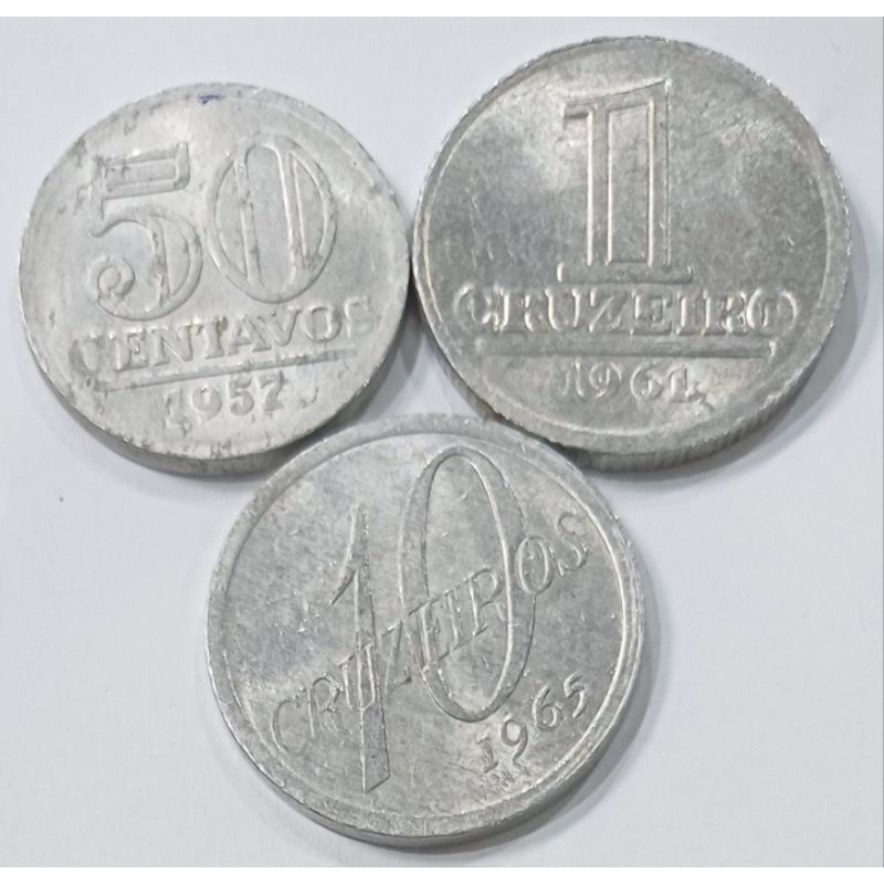 3 moedas em alumínio: 50 centavos de 1957, 1 cruzeiro de 1961 e 10 cruze1 cruzeiro de 1961 e 10 cruzeiros de 1965  mbc