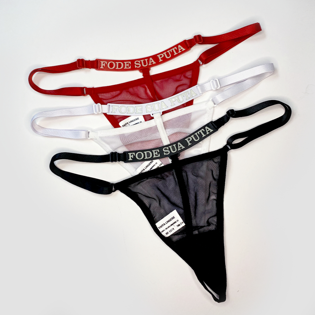 CALCINHA FIO DENTAL COM FRASE "FODE SUA PUTA" QUE BRILHA NO ESCURO YAFFA LINGERIE