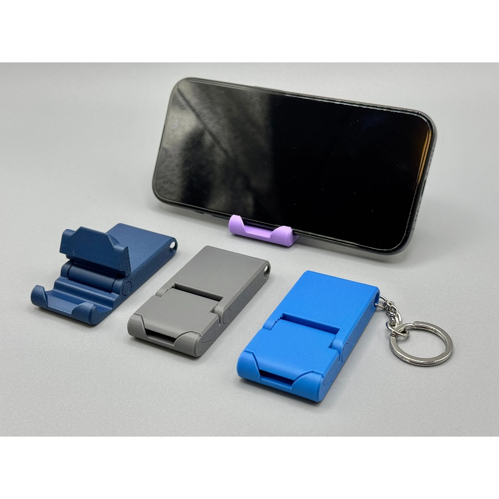 Chaveiro Suporte Para Celular Dobrável Portátil Universal Mesa Compacto Leve Resistente Várias Cores