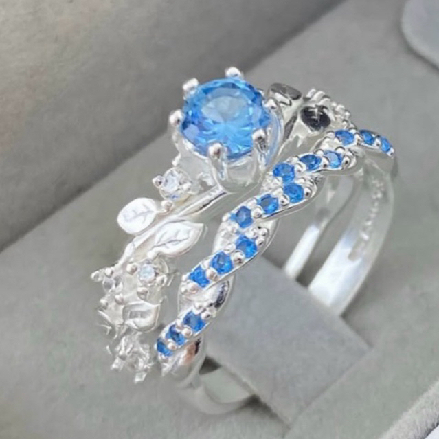 Aliança Trançada INTERCALADO + Solitário flor Azul Prata 950
