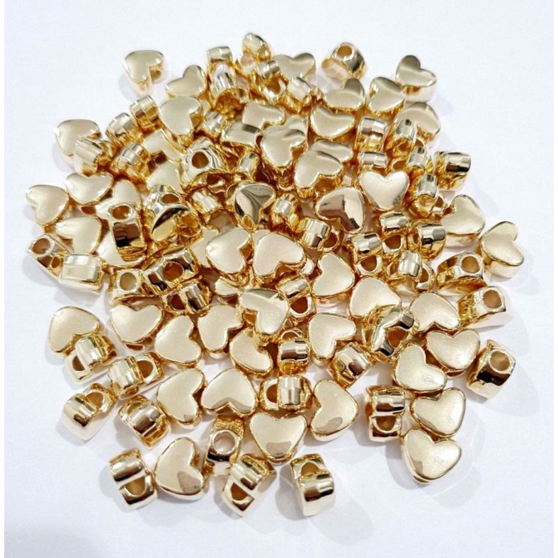 Micanga coração Dourado11mm 50pecas em Oferta na Shopee