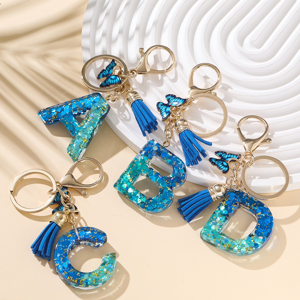 Resina 26 inglês carta chaveiro carta chaveiro cristal azul real borla borboleta pingente atacado em Oferta na Shopee