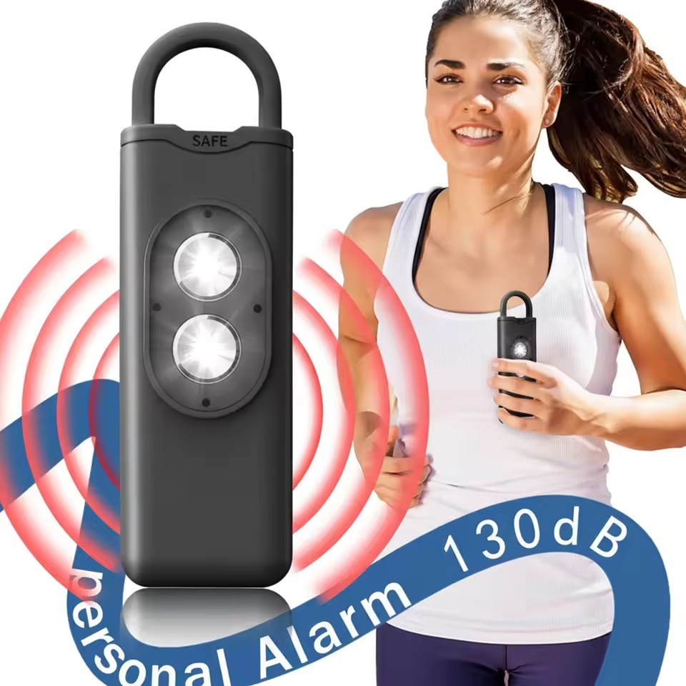 Nova Sirene De Autodefesa ABS Portátil Luz LED Alarme De Segurança Com 130dB SOS Pessoal Chaveiro Alarmes Para Mulher