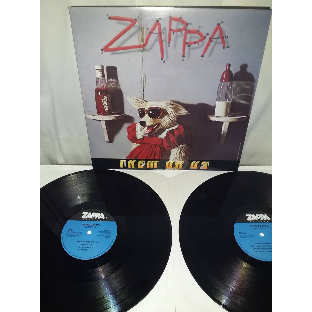 LP Frank Zappa ‎- Them Or Us. Importado. ( Steve Vai, Captain Beefheart )