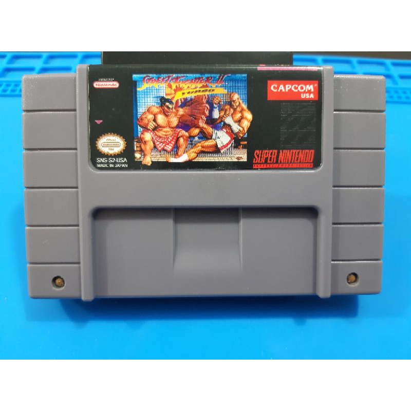 cartucho de super Nintendo street fighter 2 turbo.