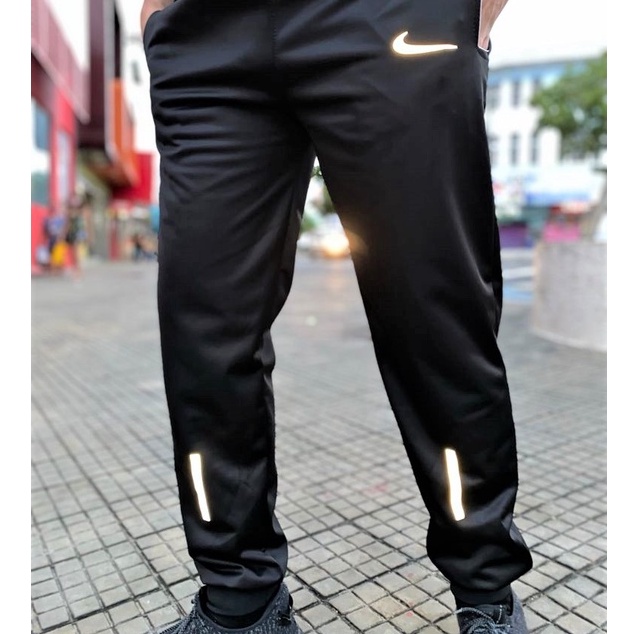 Calça da best sale nike corta vento