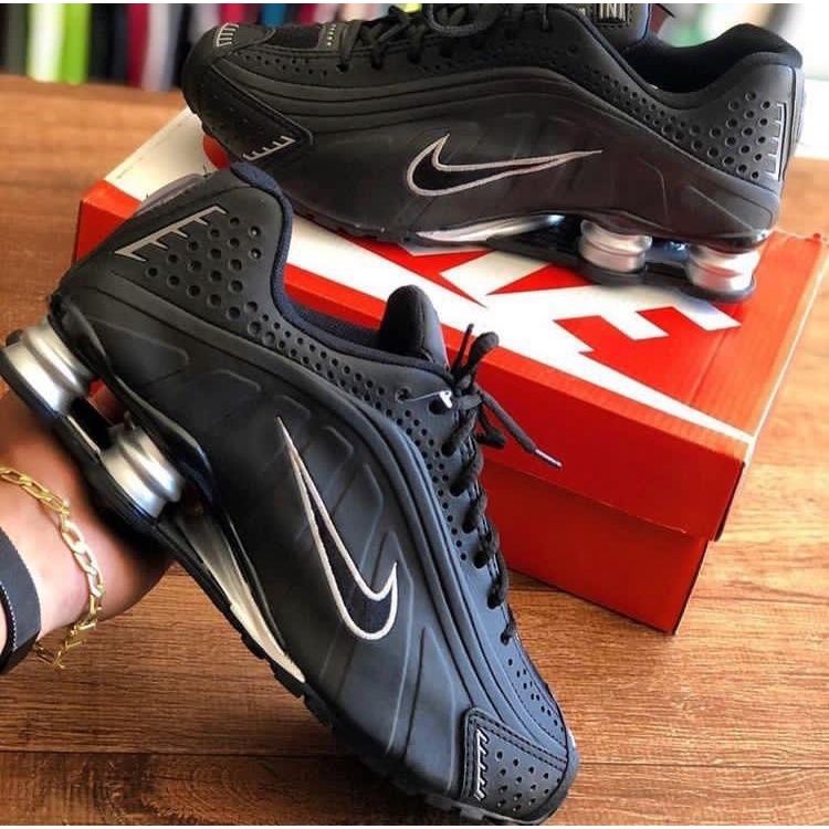 Tenis nike shox masculino preto best sale e vermelho