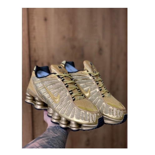 Nike shox 2024 junior dourado