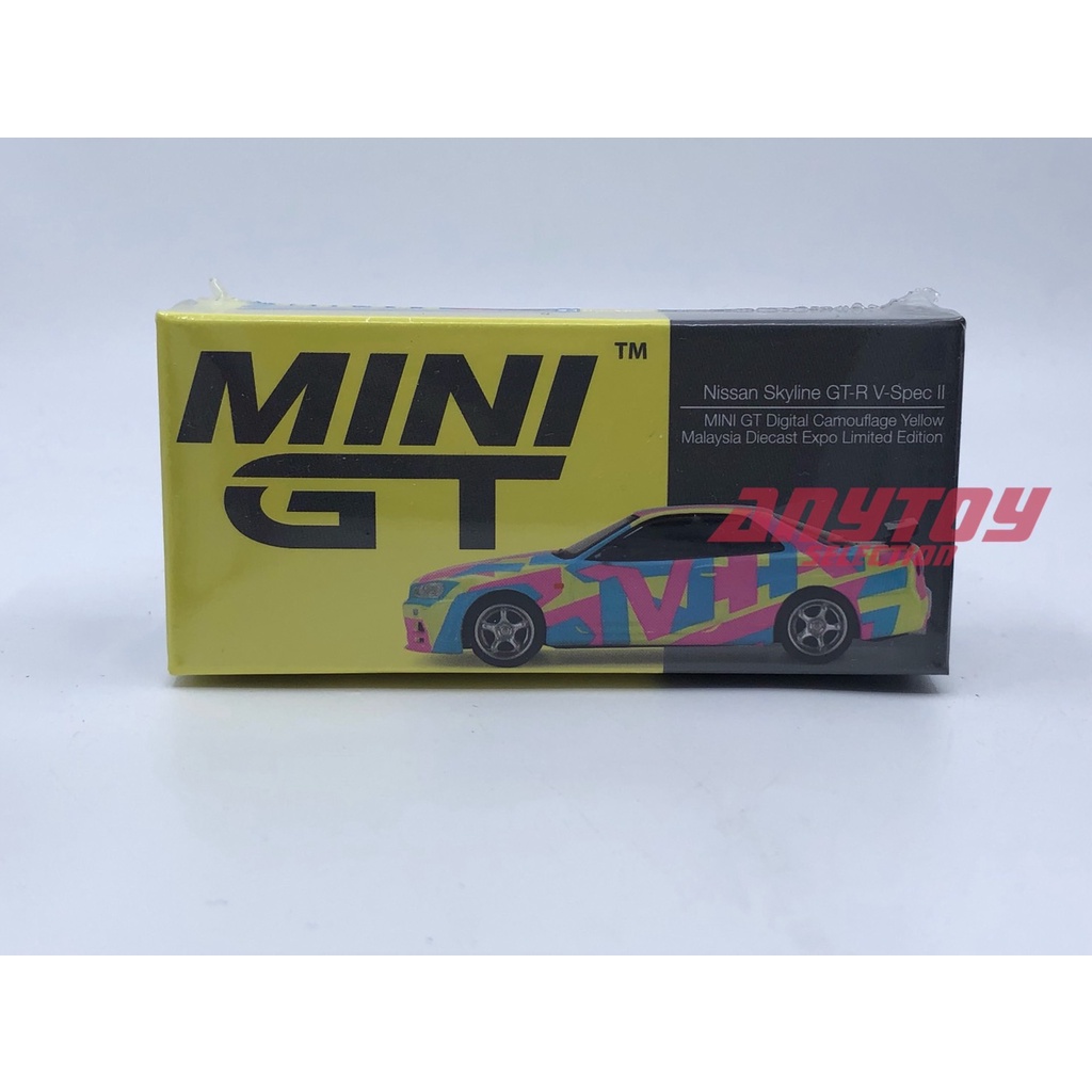 Mini GT Nissan Skyline-R V-Spec II MDX22 Malásia DIECAST Expo Limited 1 : 64 Camuflagem Digital Amarelo SCALE Modelo Carro
