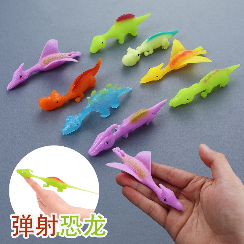 【10pcs 】Brinquedo de Descompressão Criativo de Catapulta de Dedo de DinossauroNovo Brinquedo Exótico de Dedo de Borracha