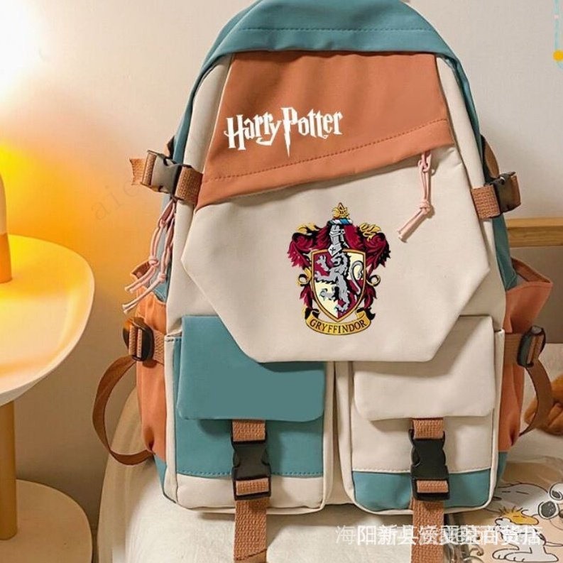 Harry Potter saco escolar Escola Mágica Hogwarts Estudante Mochila Oxford pano impermeável de grande capacidade saco de computador de viagem ins vento costura cor Ambiente do filme-1 em Oferta na Shopee