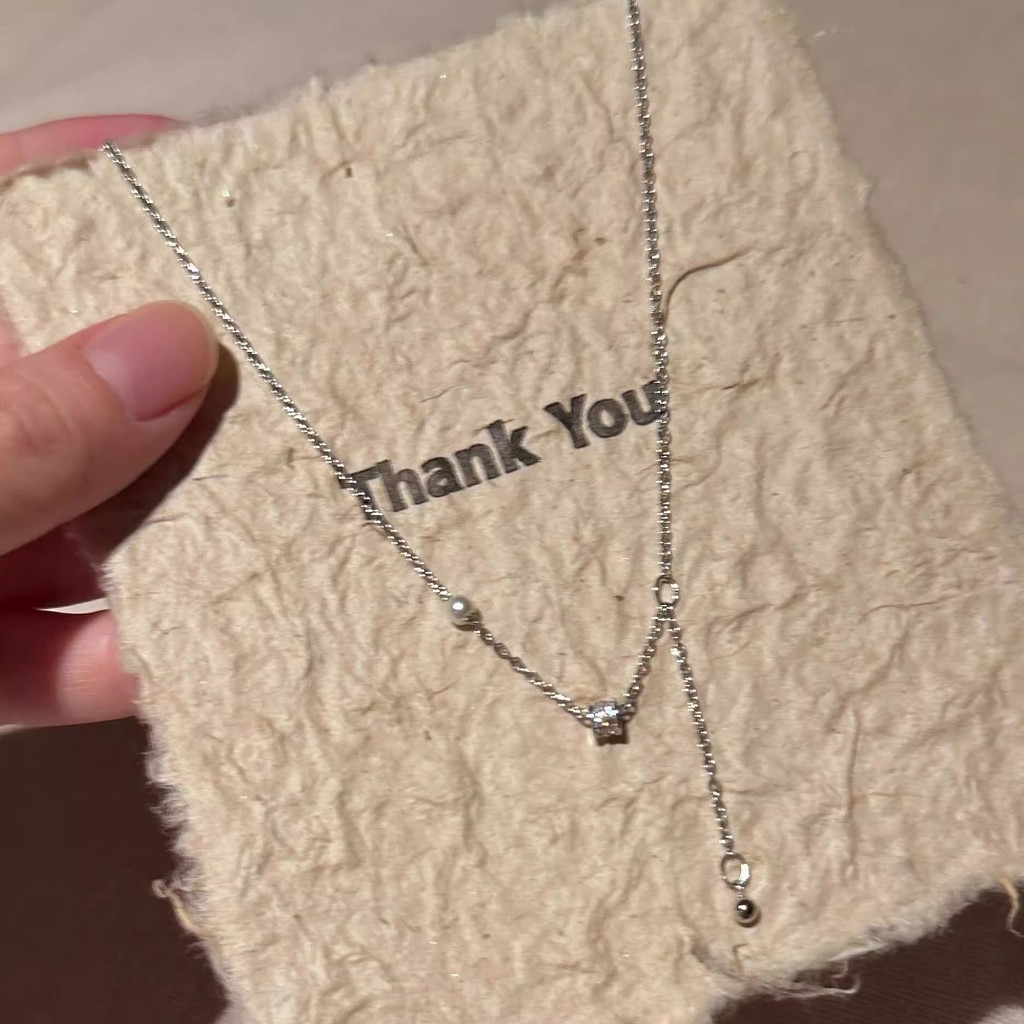 Requintado pequeno fluxo de cintura colar feminino High-End longo pingente colar luz luxo elegante pérola clavícula corr