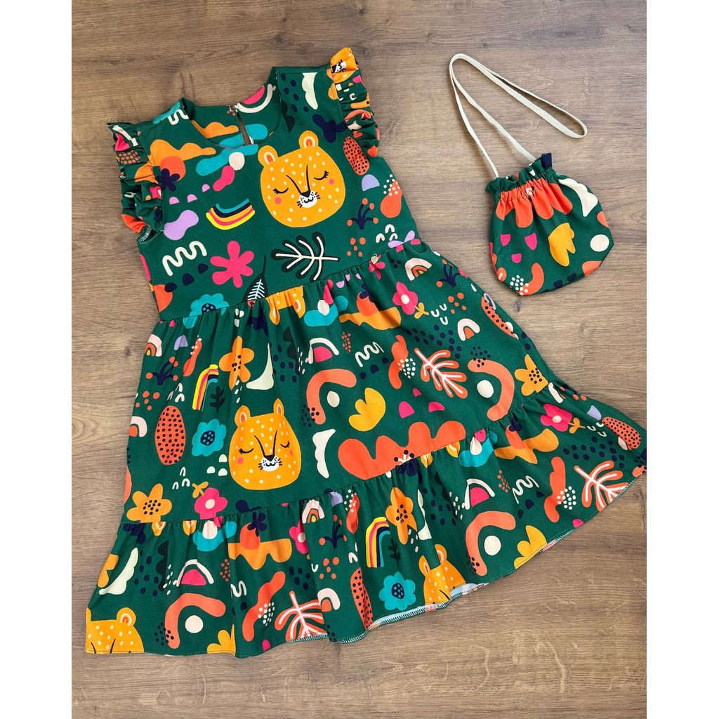 Vestido Infantil Menina Soltinho com Babados Estampa Lúdica e Bolsinha em Oferta na Shopee