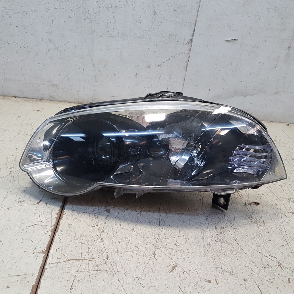 Farol Esq Masc.Negra Palio Essence Dualogic 2011 Ft3006 Mn