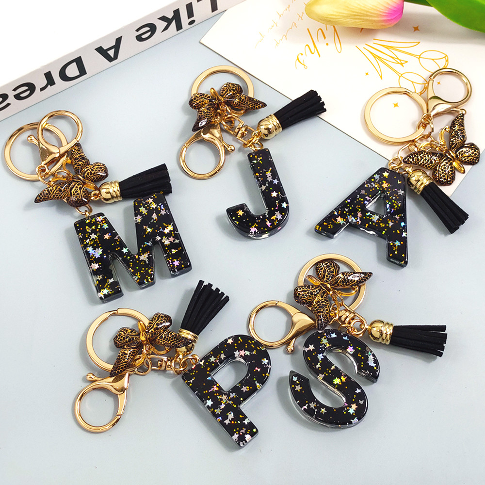 1 Pçs Colorido Lantejoulas Estrelas Letras Chaveiro Preto Borla Borboleta Iniciais Bolsa Pingente em Oferta na Shopee