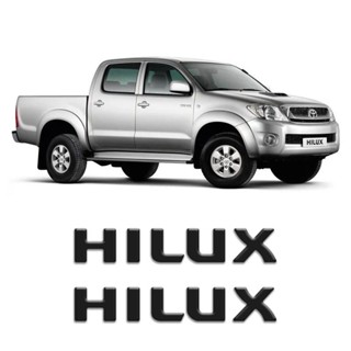 Par de Adesivos Emblema Hilux Preto Resinado Santo Antonio em Oferta na Shopee