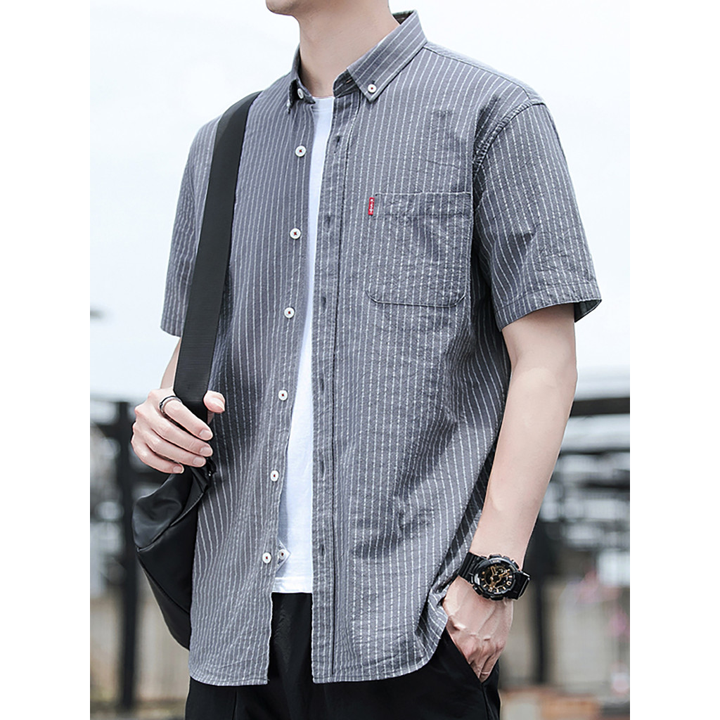 2026 verão nova camisa de algodão fino listrado solto Casual branco Polegada camisa de manga curta masculina na moda Plu