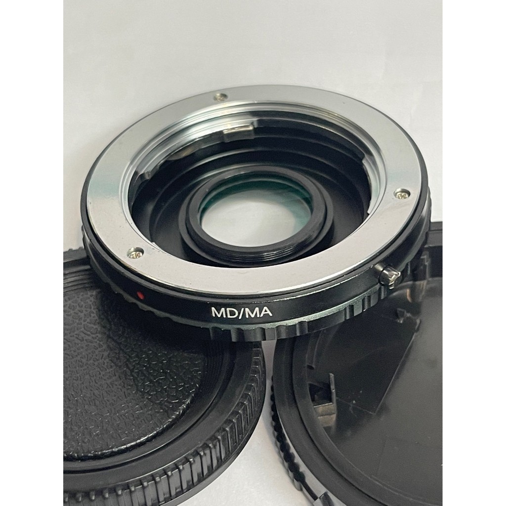 O adaptador Minolta MD para câmeras Sony MA, anel adaptador de vidro MD-MA, permite foco infinito.