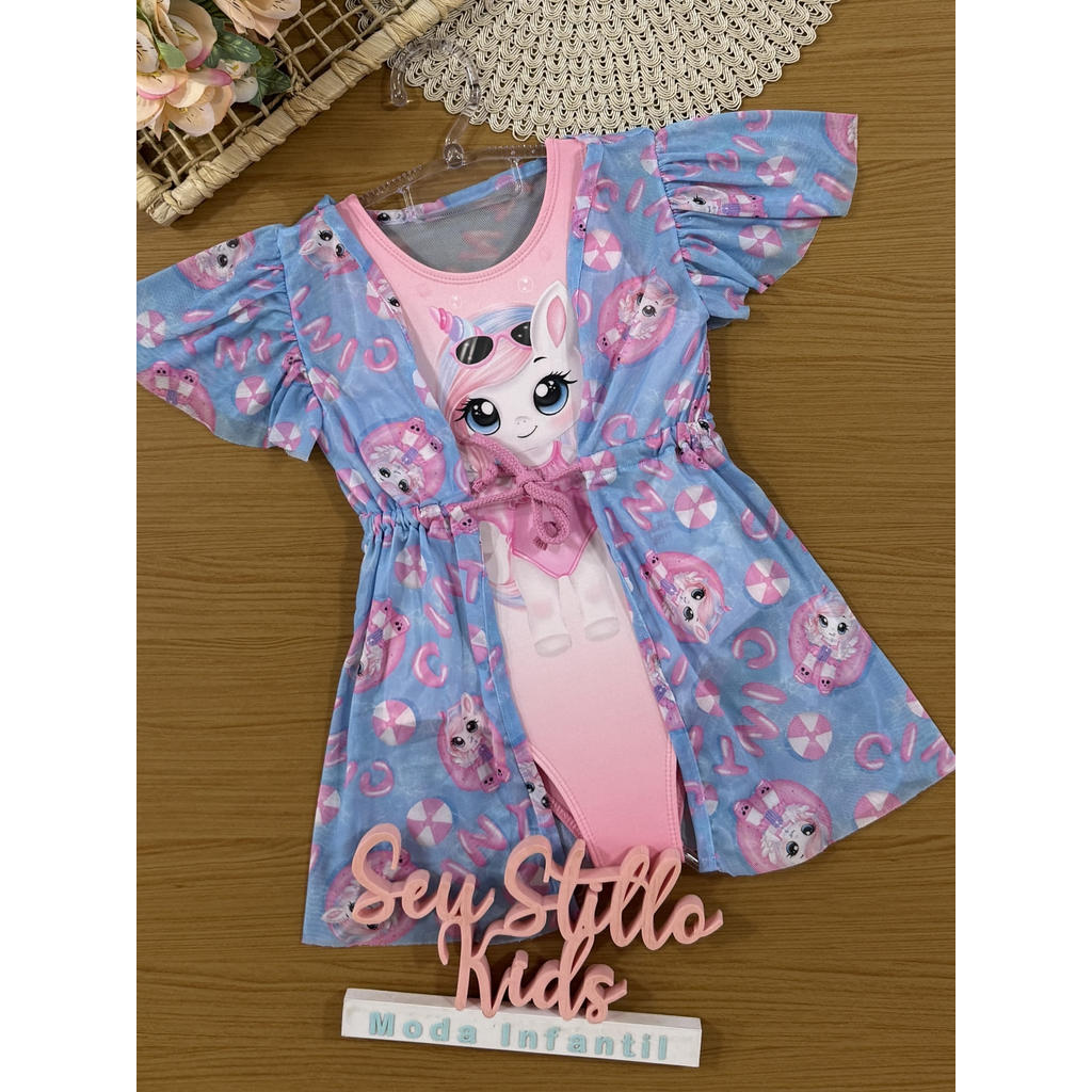Maiô Infantil Cinti Rosa Unicórnio com Saída de Praia Azul | Verão 2026 em Oferta na Shopee