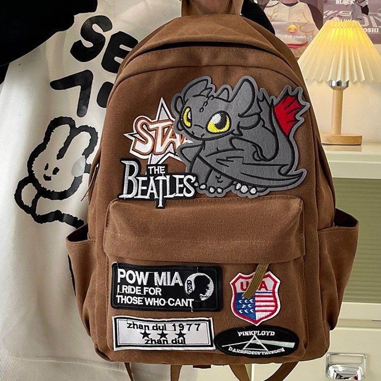 Mochila Estilo Retro Americano Pequeno Monstro Dois Desenhos Animados Mochila Essencial de Hip-Hop Fashionável para Viag em Oferta na Shopee