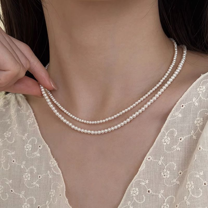 [Estoque pronto] Shijia pequena lâmpada concha grânulo colar feminino bebê Xiaomi grânulo luz luxo francês clavícula cor