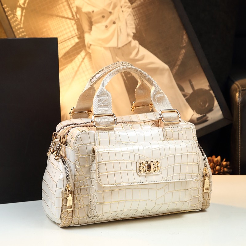 Luz de luxo senhora Boston bolsa feminina 2024 novo estilo couro genuíno portátil travesseiro saco moda bolsa ombro simp