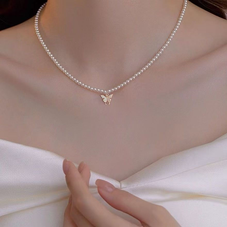 Borboleta painço pérola colar high-End colar de alto valor elegante clavícula em forma de coração colar de pérolas novo