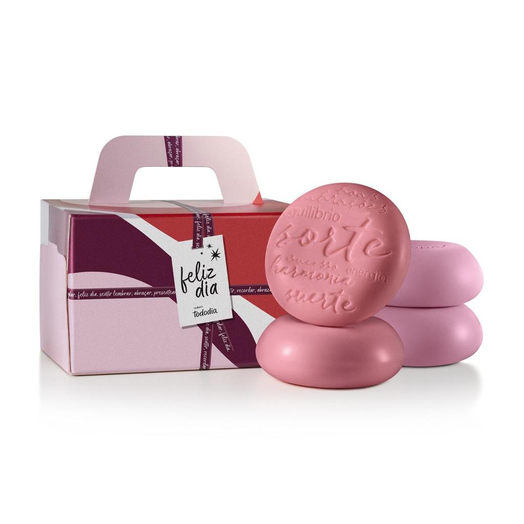 Kit de presente Natura Tododia contendo uma caixa decorada com laço e quatro sabonetes em barra cor-de-rosa, sendo um deles em destaque à frente