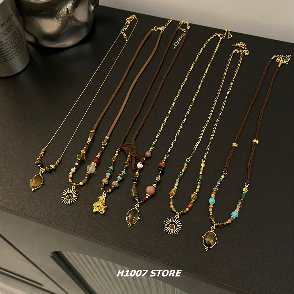 ♦Merad estilo étnico Retro olho de tigre frisado colar feminino nicho Design sentir High-End clavícula corrente camisola